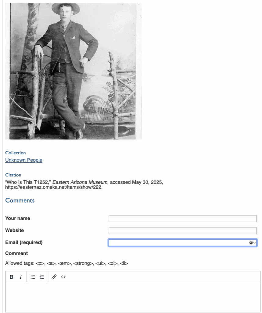 black and white photo of man wearing a suit and hat leaning against wood furniture. Photo is inside and looks old.